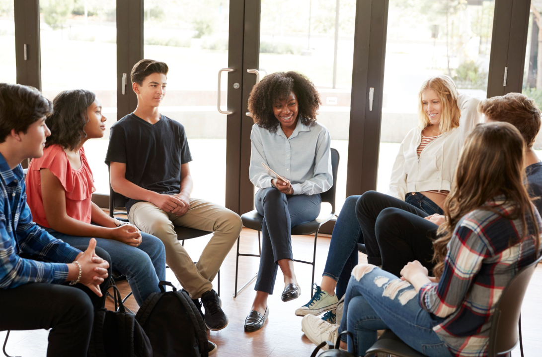 students in a circle for group session